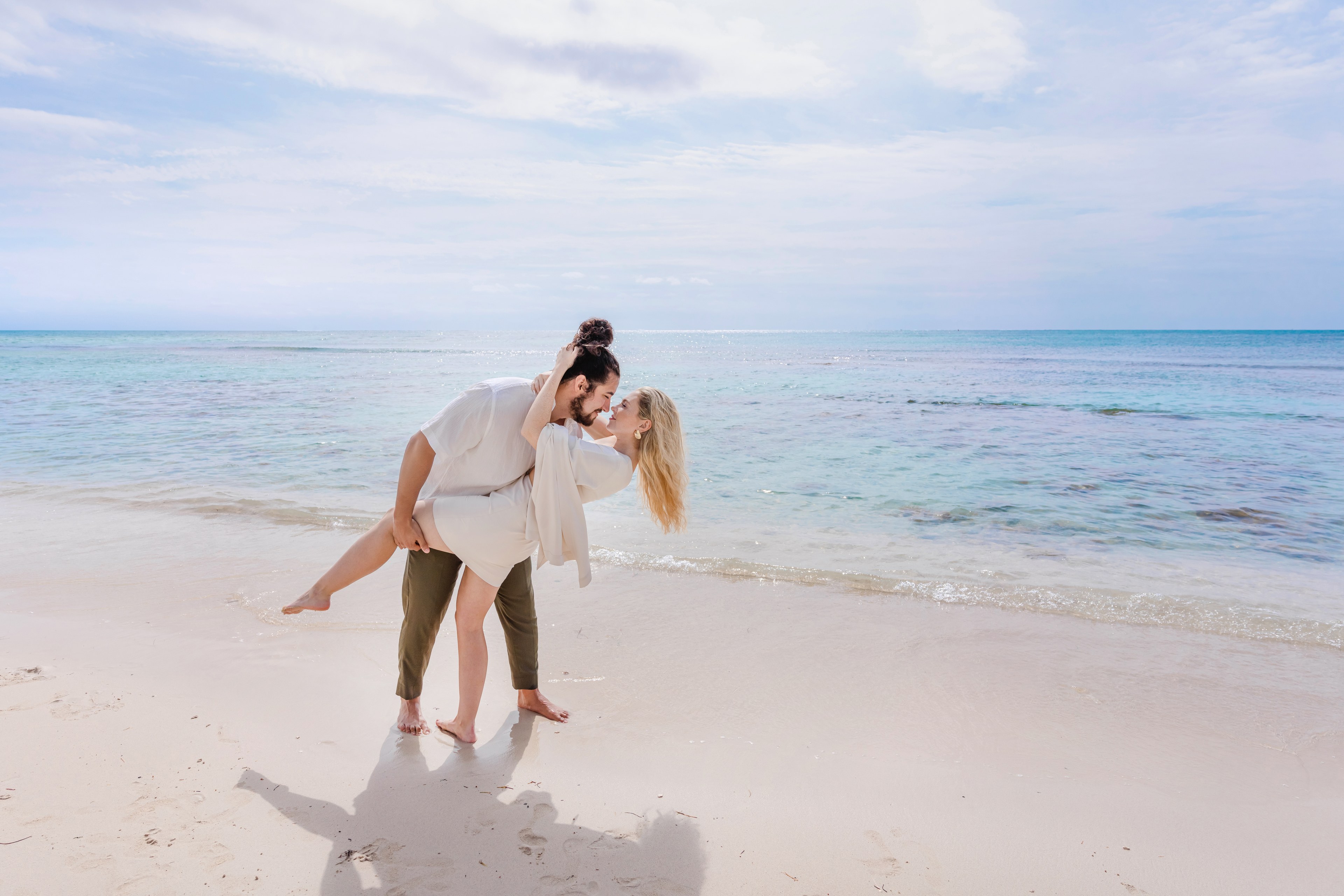 Editorial couple portrait on Cancún beach showing why interviewing photographers carefully matters — IVAE Studios