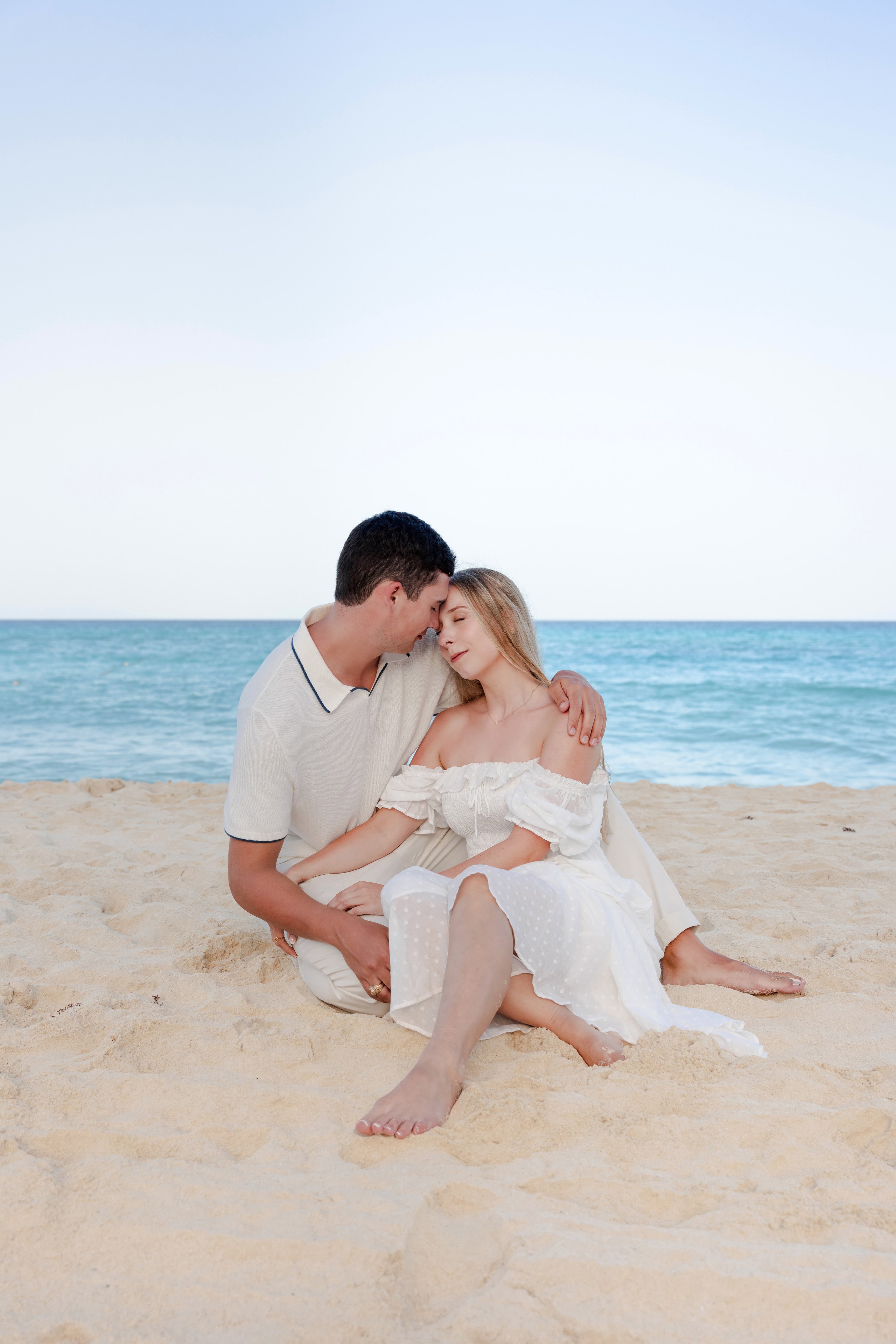 Couple looking at each other on the beach