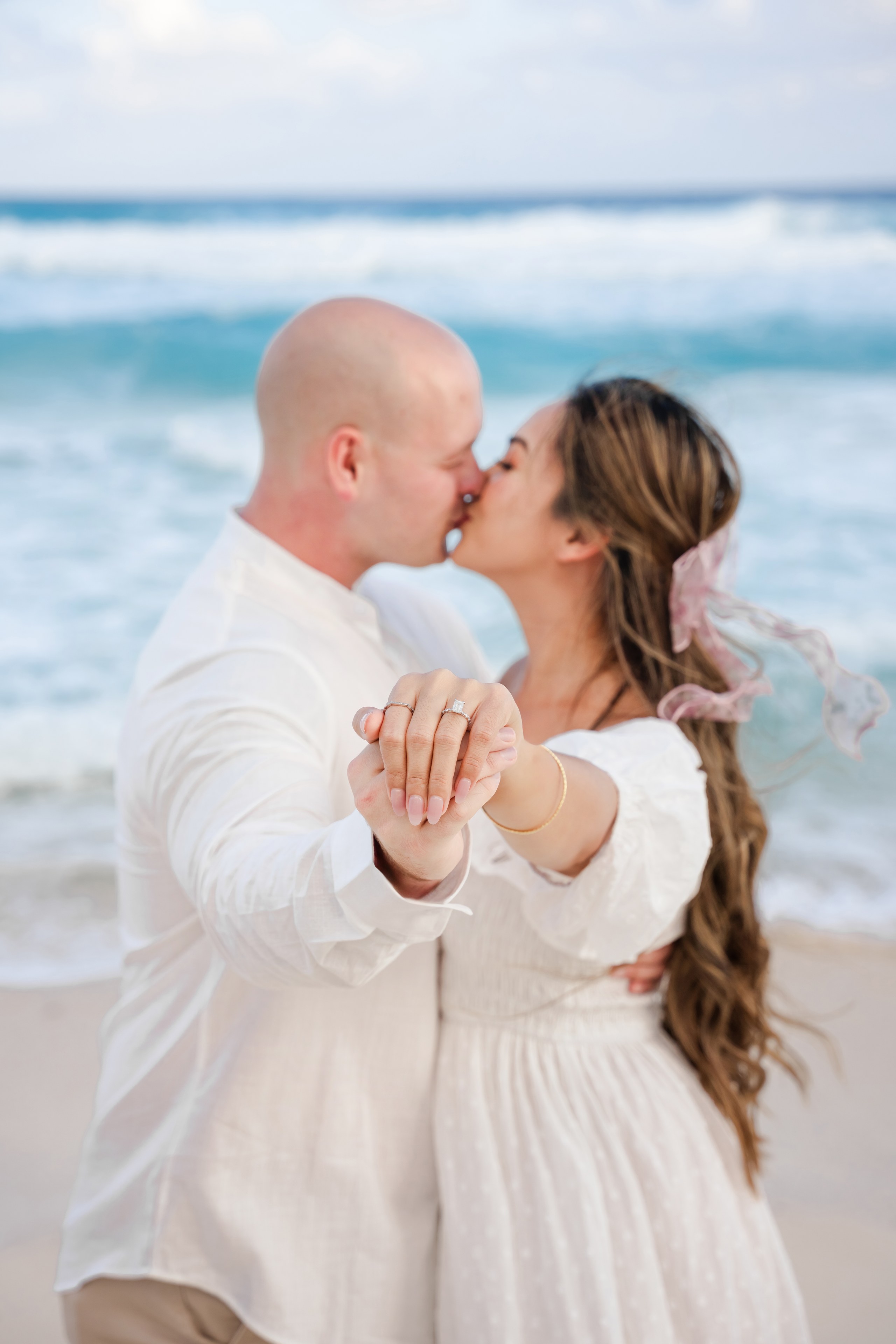 Couple at Playa Mujeres in an editorial seaside portrait by IVAE Studios