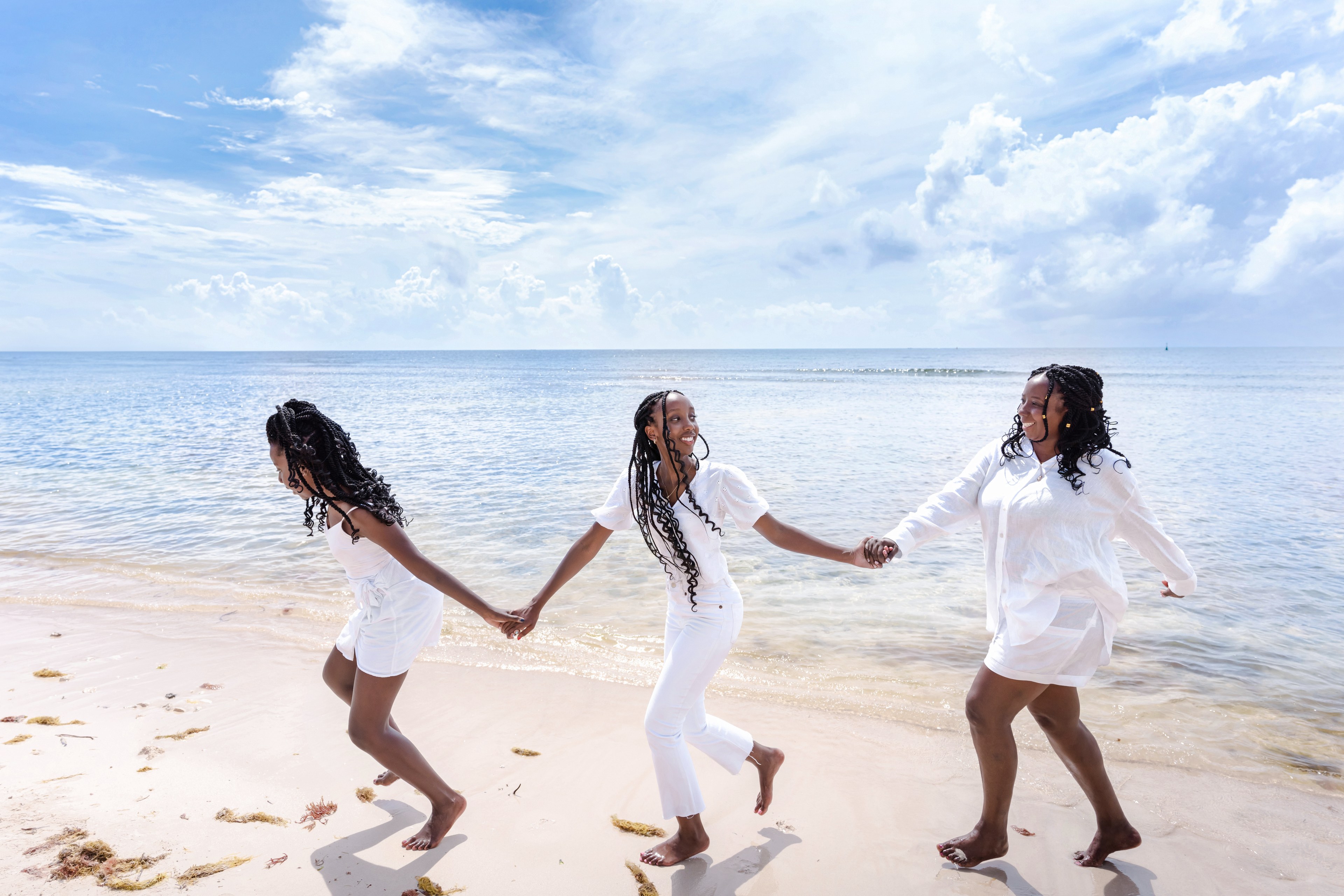 Golden hour beach photography session on the white sand shores of Playa del Carmen