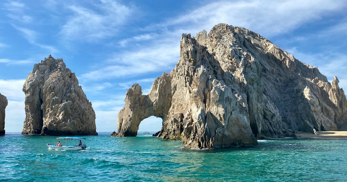 Dramatic desert cliffs meeting turquoise Pacific waters at the southern tip of Baja California Sur near Land's End