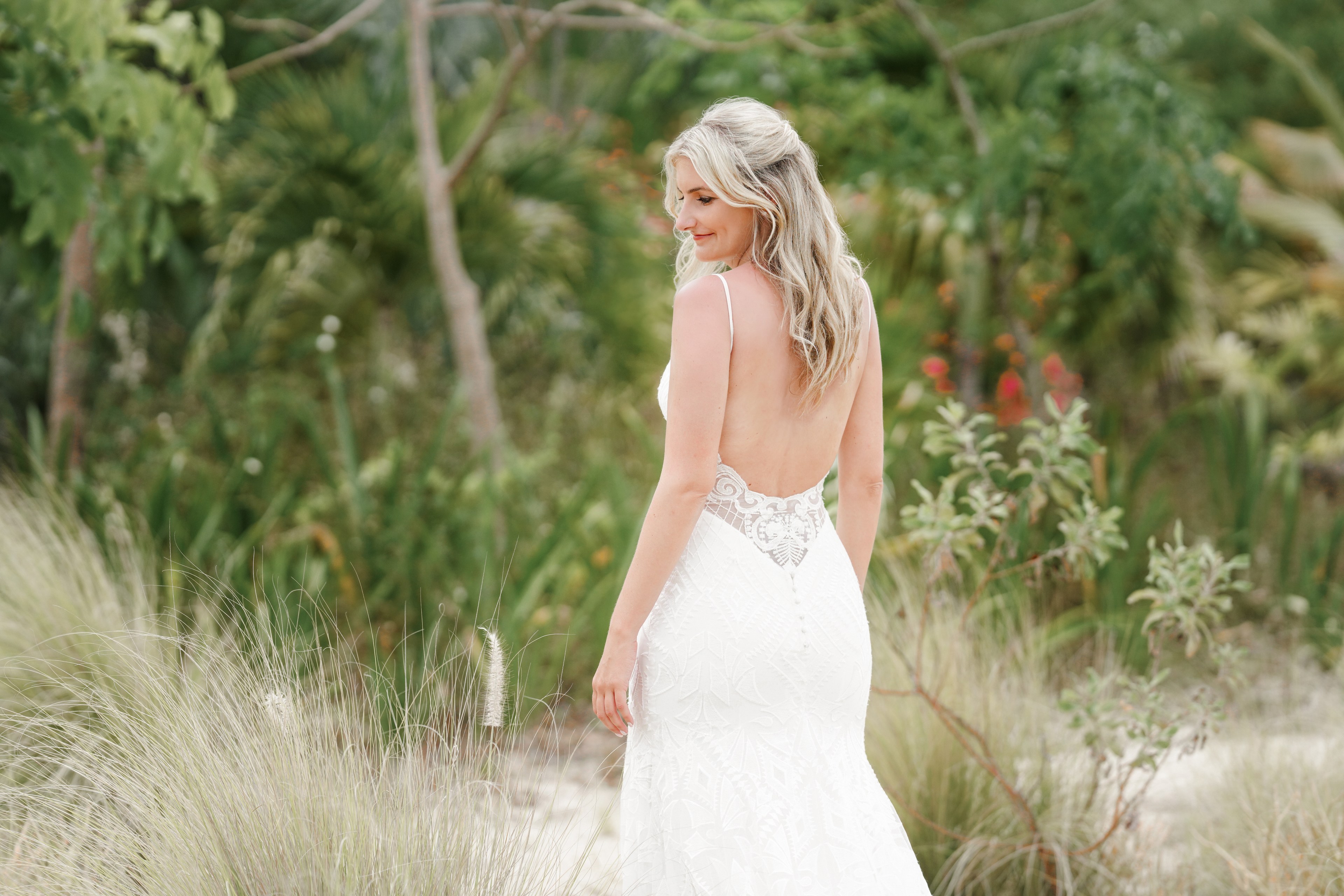 Ceremony vows in candlelight at Rosewood Mayakoba, photographed by IVAE Studios.