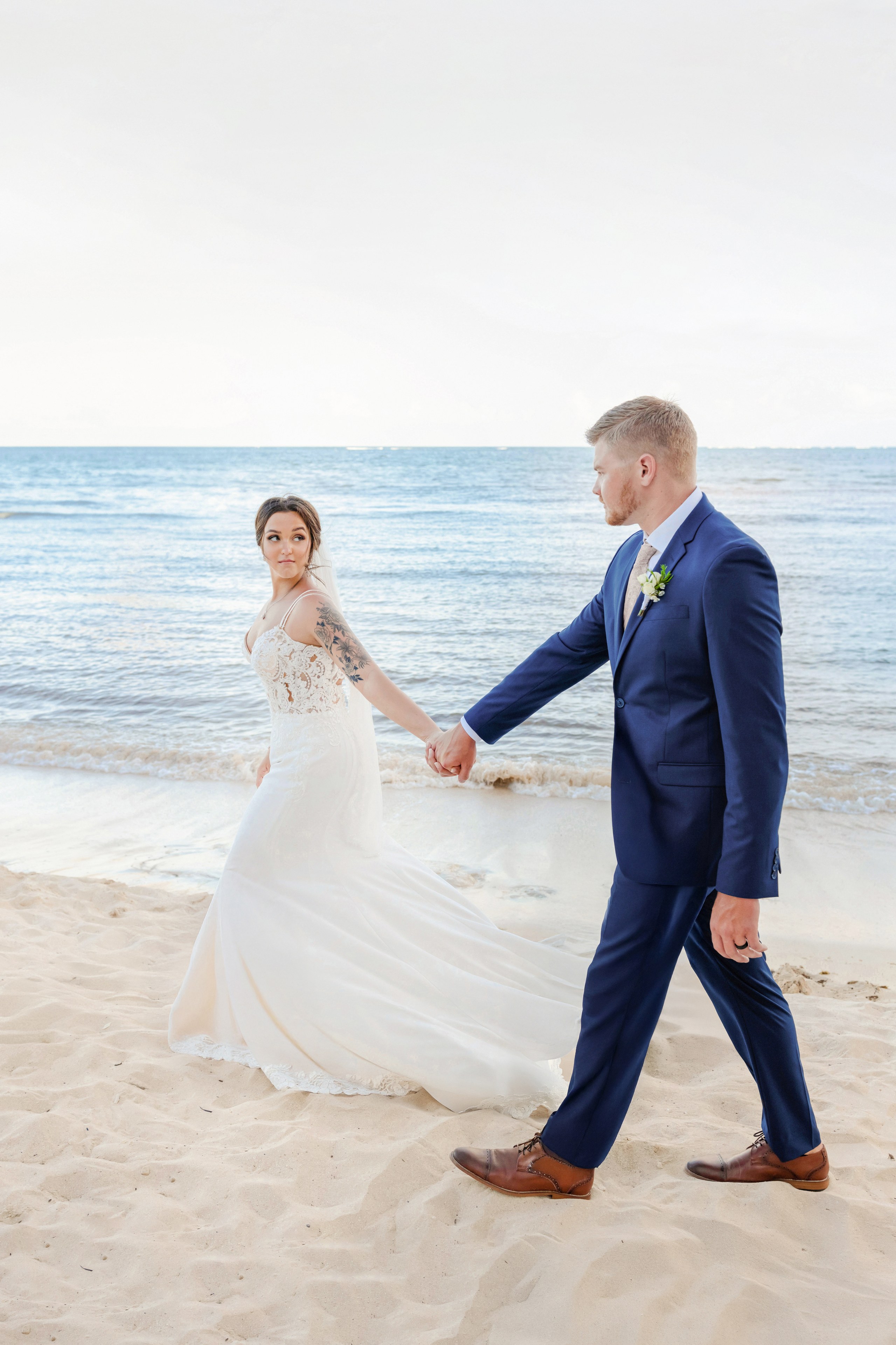 A bride and groom in a mangrove garden at Rosewood Mayakoba, photographed by IVAE Studios.