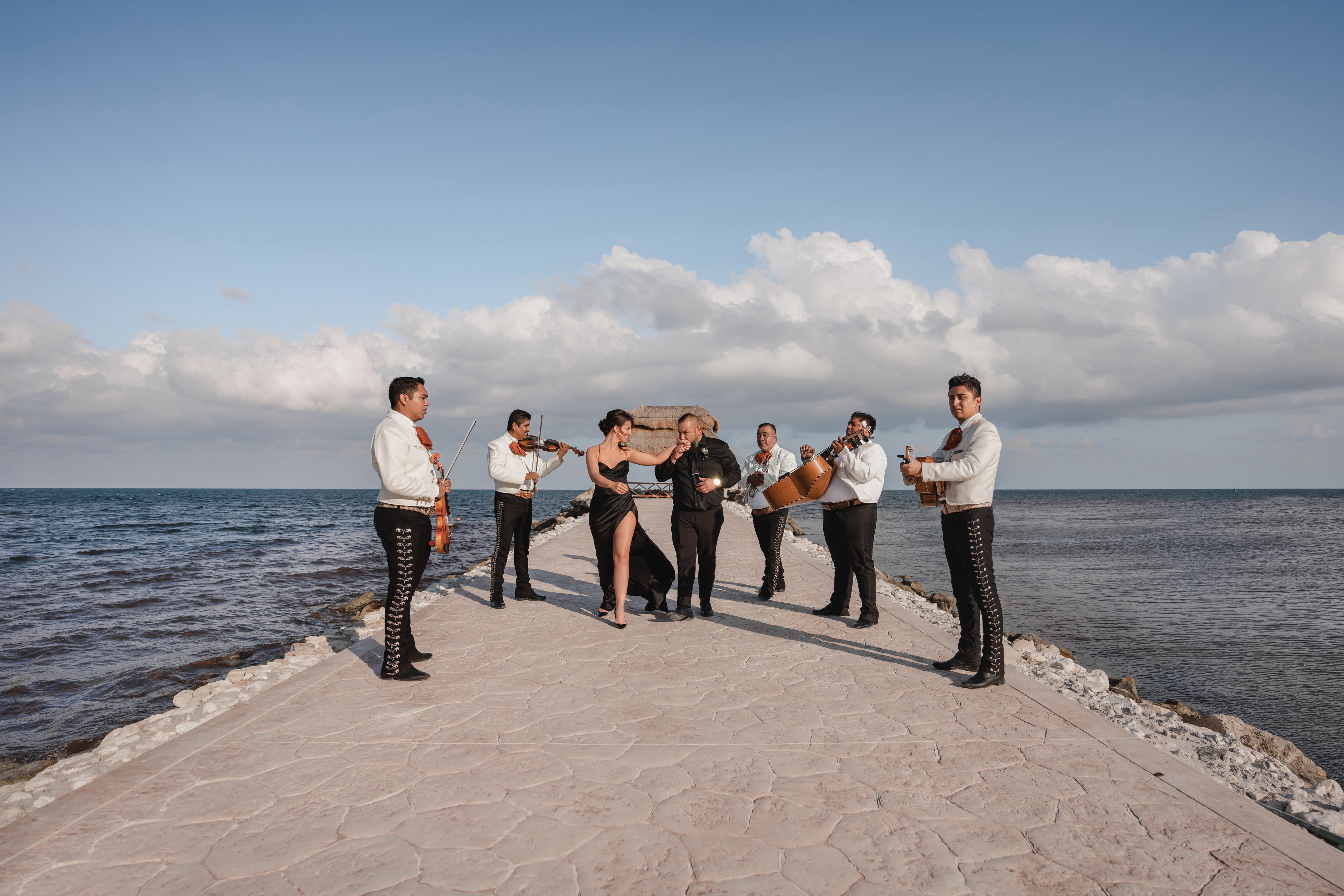 Groom mid-toast reception Cancún beach IVAE Studios sample wedding photos