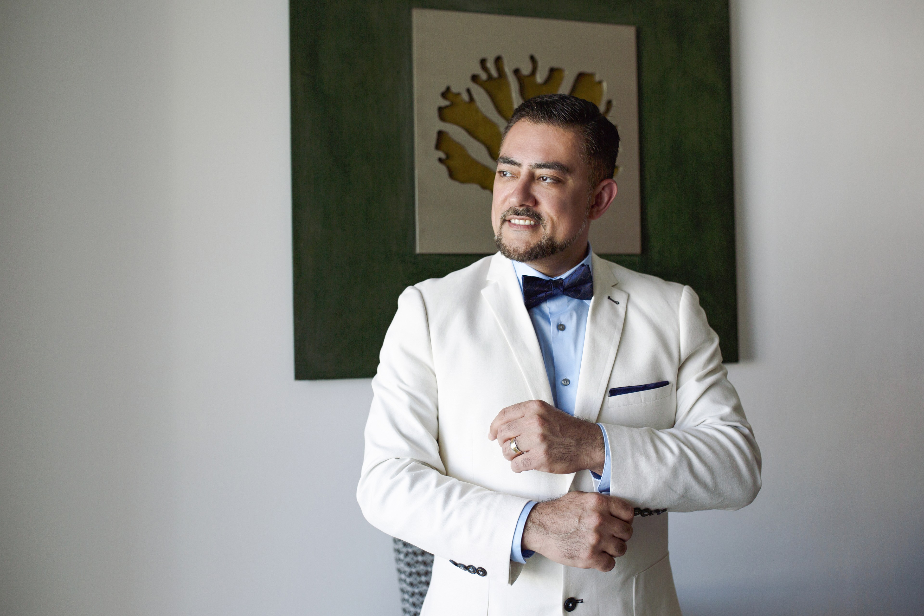 Groom photographed in the Cancun Hotel Zone during the final minutes of daylight, delivered straight from the RAW original